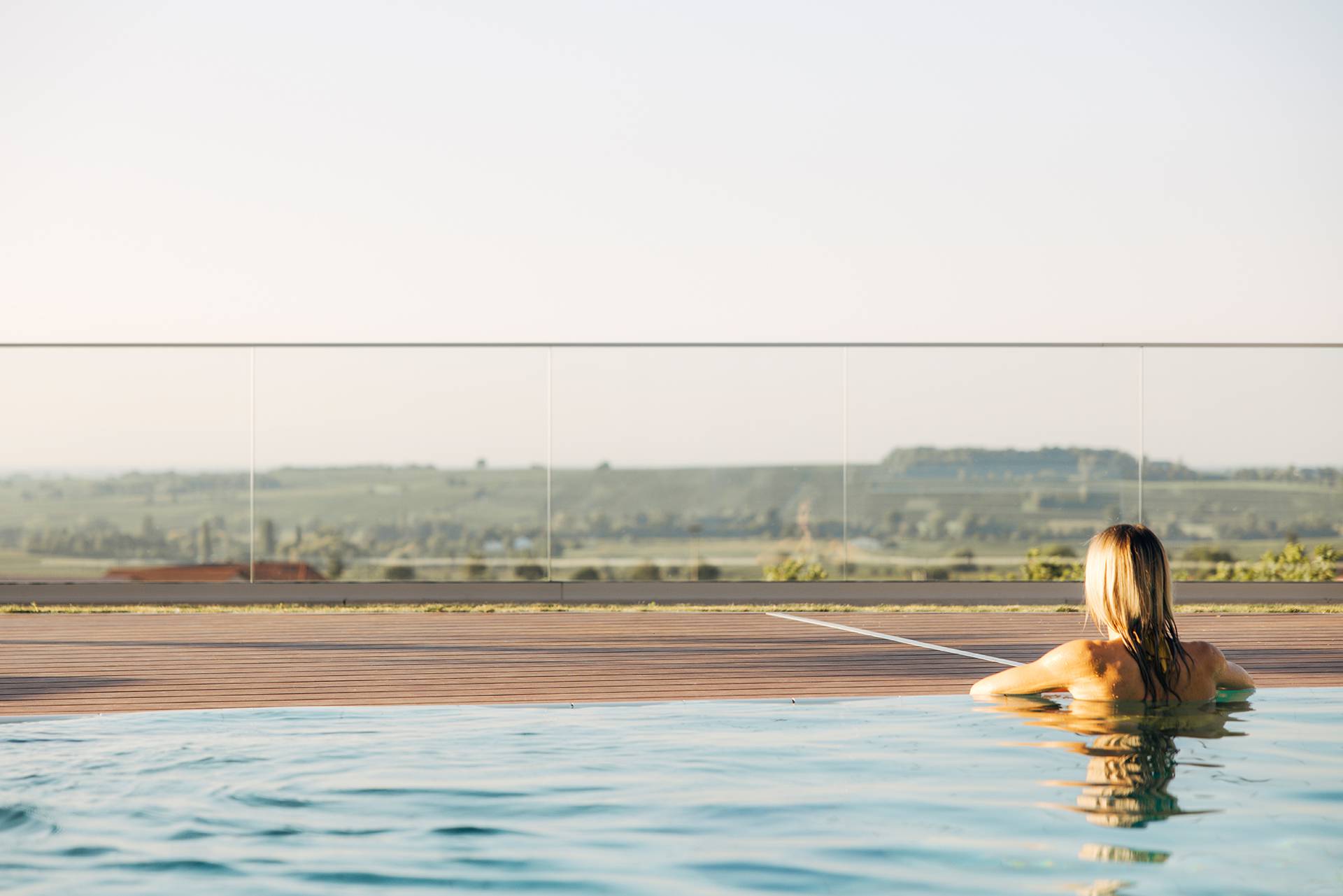 Woman in the outdoor pool at Leinsweiler Hof